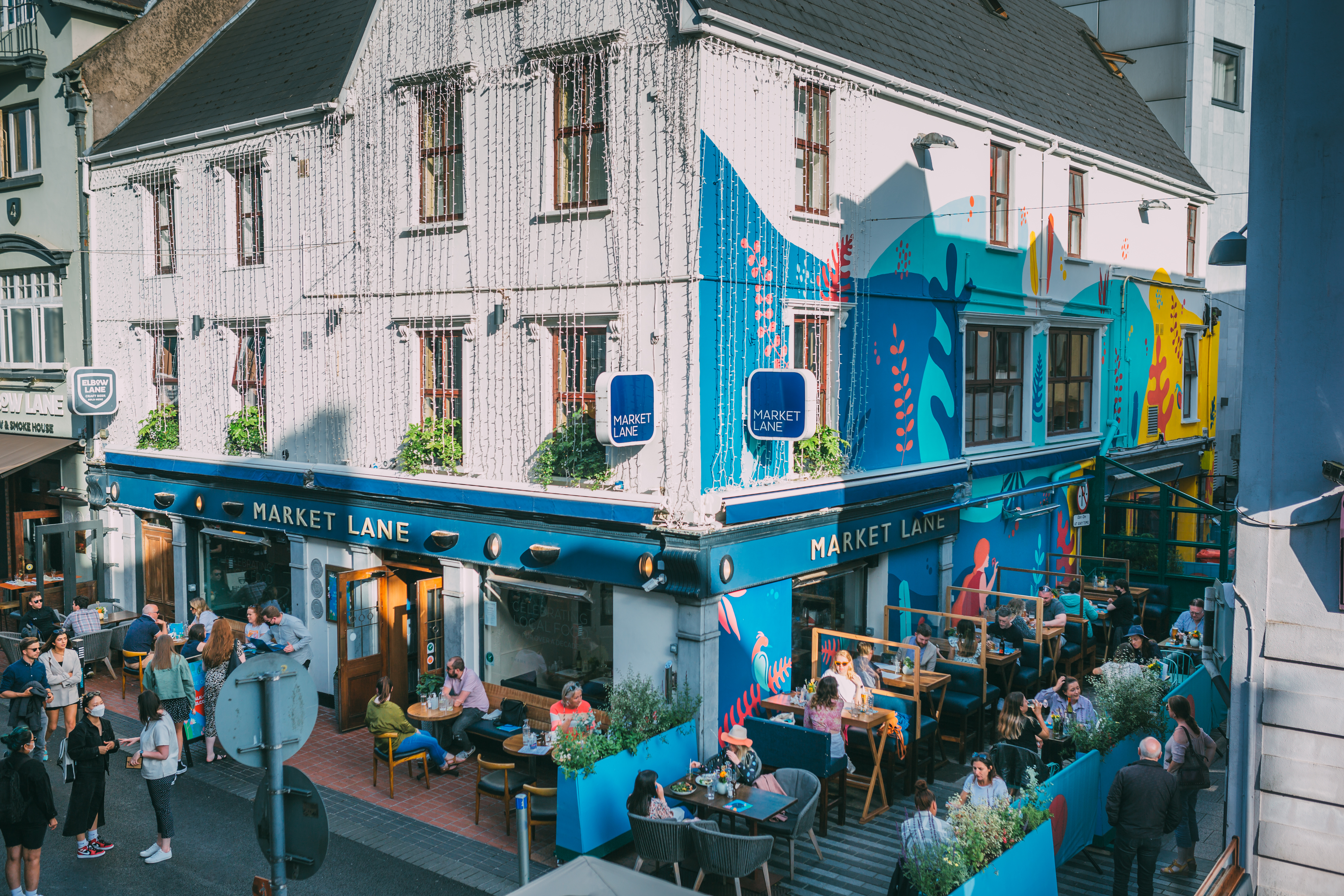 Diners seated outside the colourful Market Lane restaurant in Cork city centre